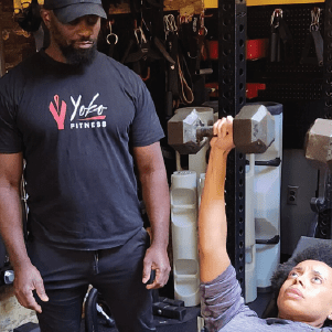 Cornelius Yoko training a woman Cornelius Yoko training a woman